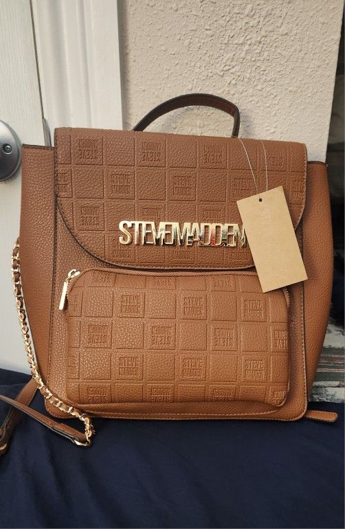 brown leather steve madden backpack Mini – black-willow-designs Featuring dome stud details and knotted fringe decals on a gusset with rounded bottom metal aglets brown Steven Madden mini backpack