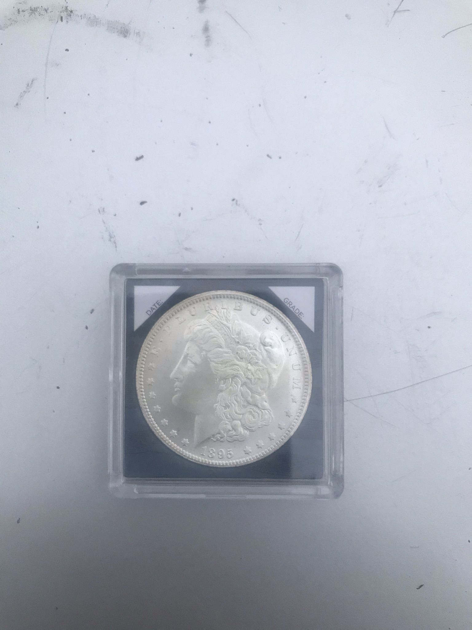 1895 O Morgan silver dollar
