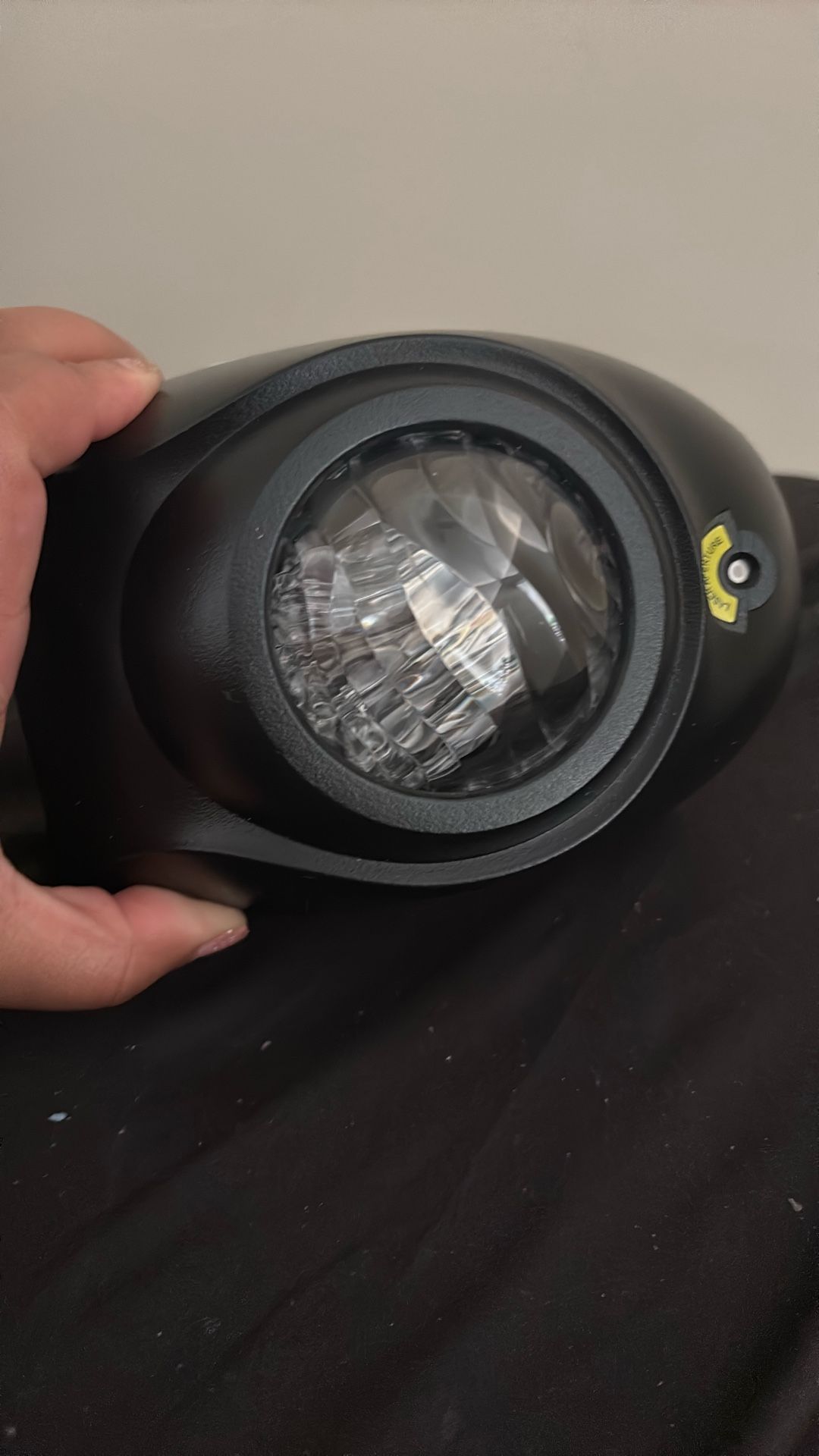 Projecter With Light Displays On To Wall