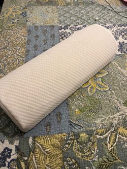 Under legs bolster. Pillow.