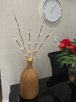 Decorative lighted branches has warm white LED lights. Comes with a light brown wooden vase. Perfect for home decor.
