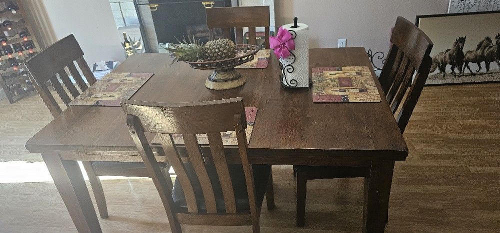 Wooden table with 4 chairs.