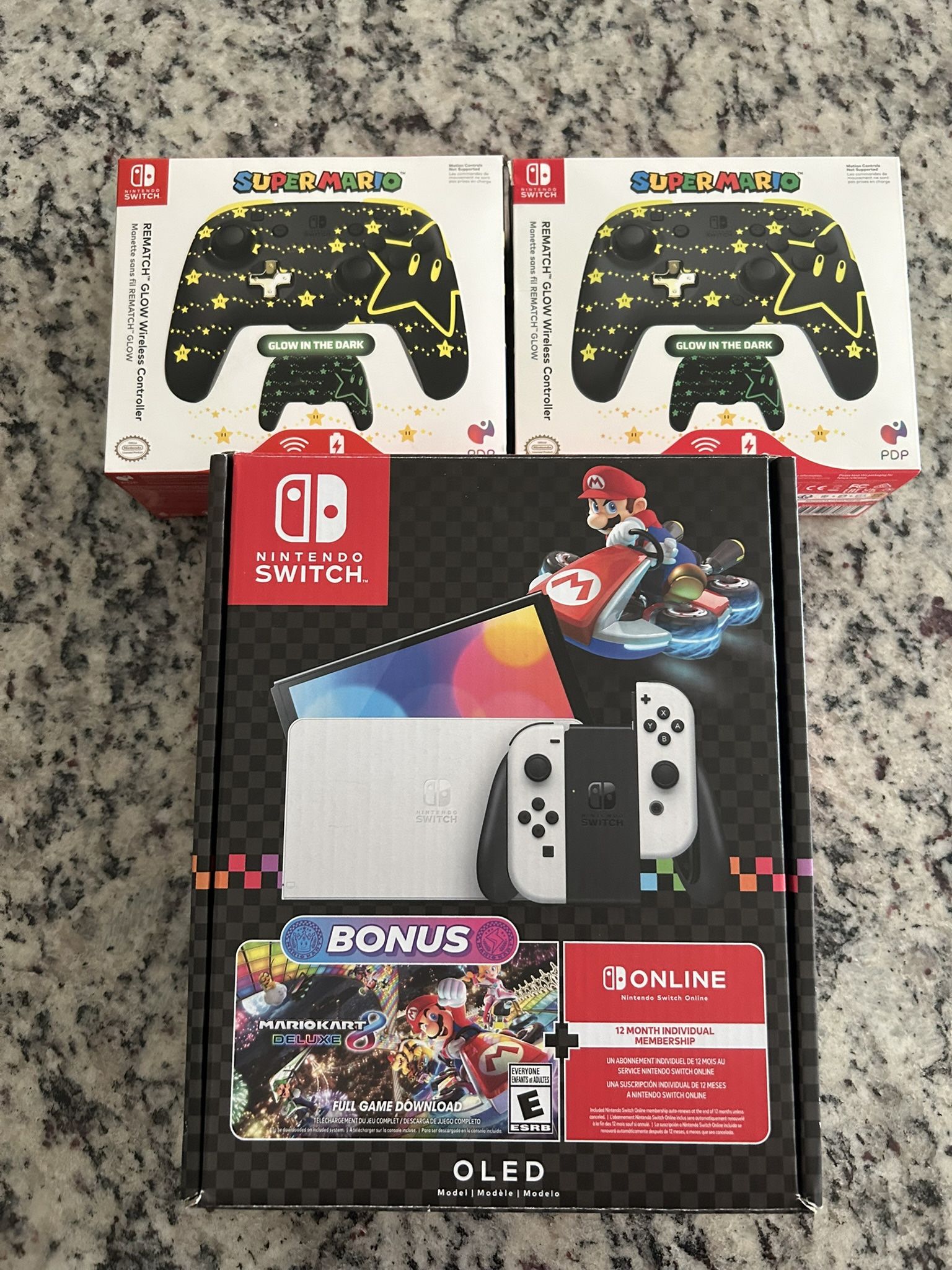 Nintendo Switch OLED + 2 PDP Glow Controllers – Mario Kart Bundle (code used)