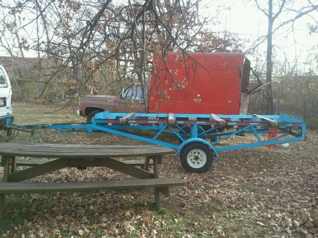 Storage tank transport trailer