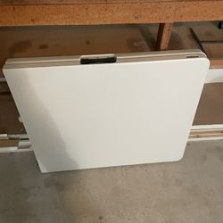 8 Folding Chairs, 1 Folding Table 