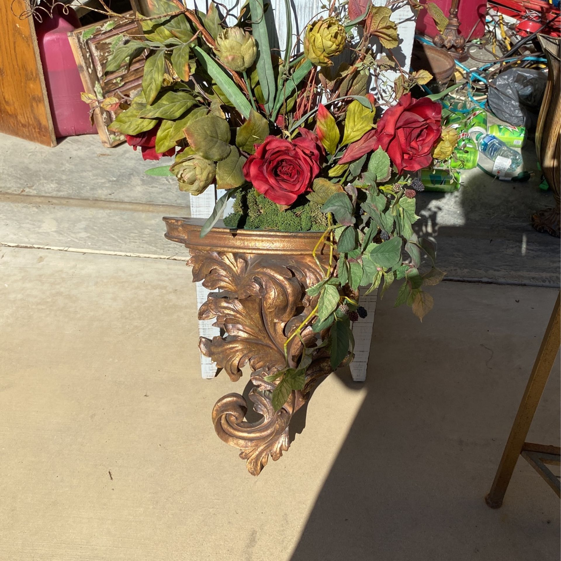 Shelf With Flower On Top Of It