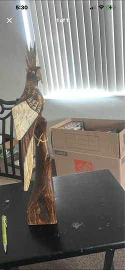 19-inch vintage hand-carved wooden parrot sculpture