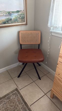 spinning leather and wicker chair