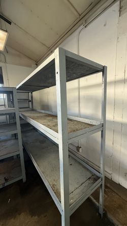 Steel shelf fabricated industrial grade. 5ft tall, 8ft in length by 22” in width.