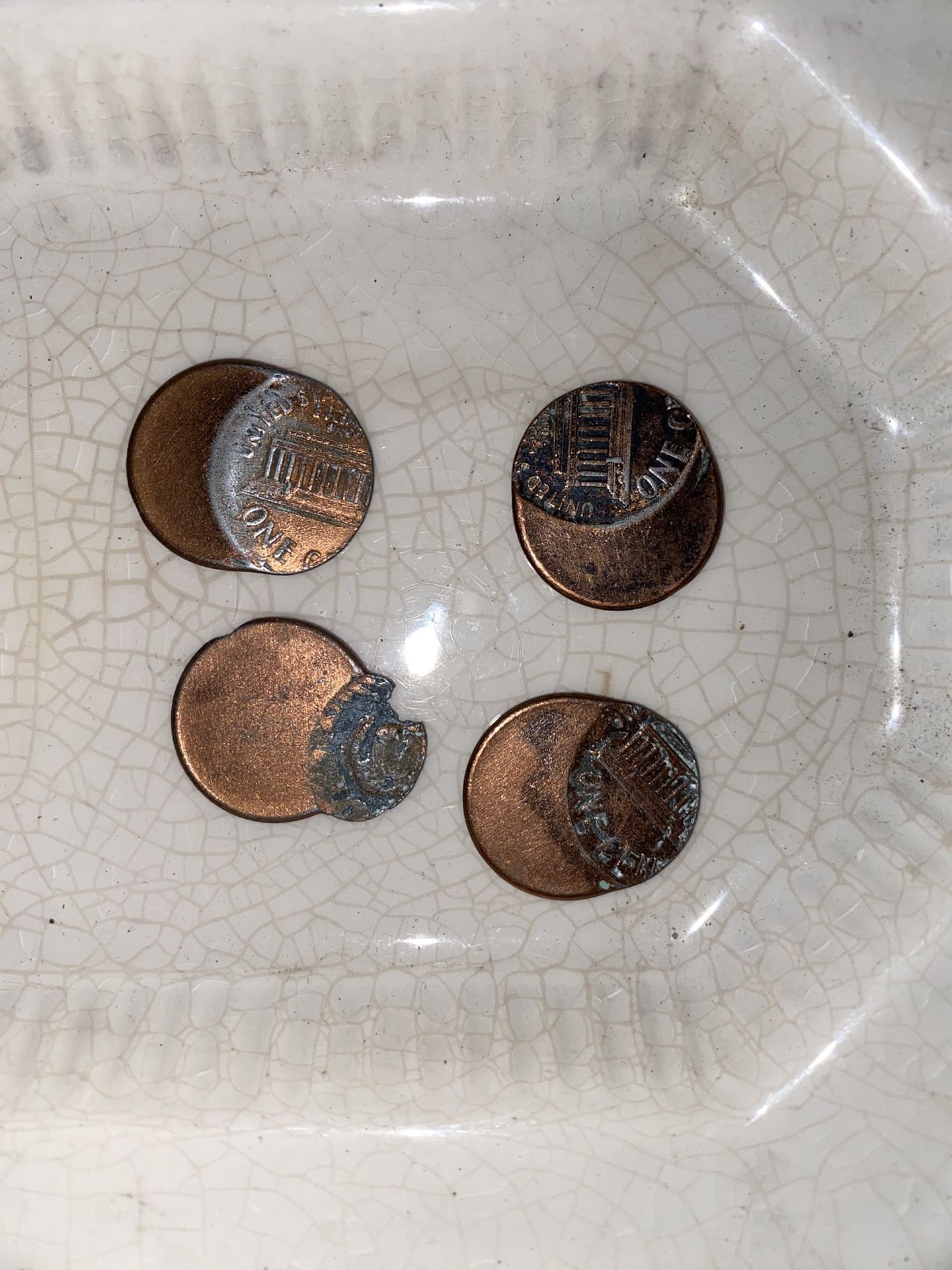 I’m four very off-center American pennies
