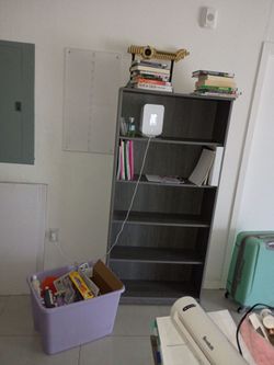 Shelf and tote of craft supplies