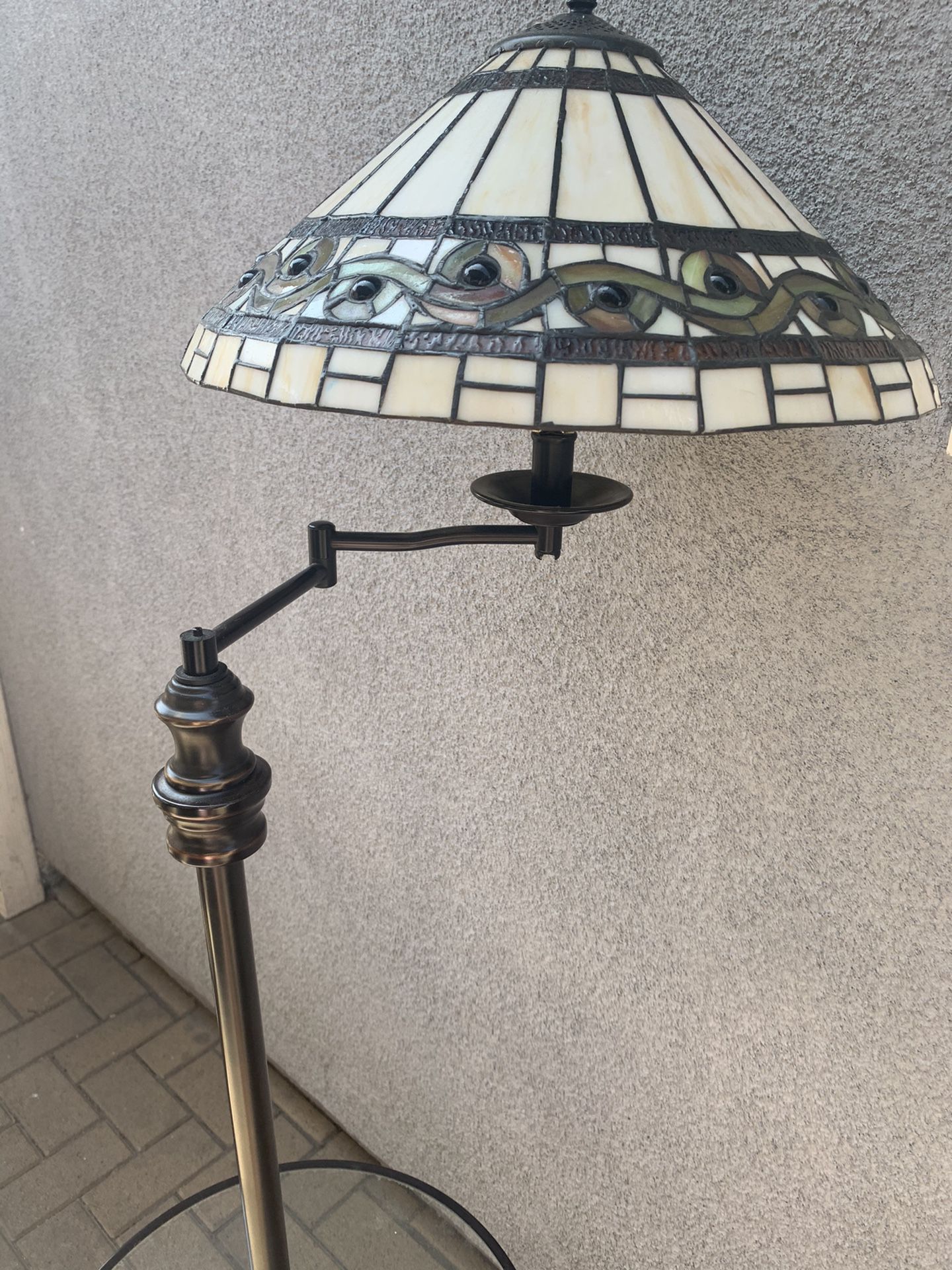 Tiffany style lamp with small table attached. Antique lamp stained glass