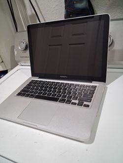 Macbook Pro laptop computer with  windows 10 installed.  Good condition.  15' screen.  intel Core 2 duo CPU processor.   wifi.  Webcam.  Bluetooth.  d