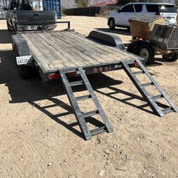 14’x80” Heavy Duty Flat Bed With Ramps.