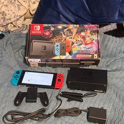 Nintendo switch with docking station, charger, joy, con, grip, wrist straps and HDMI and Mario kart 8. No trades cash only see my other listing for mo