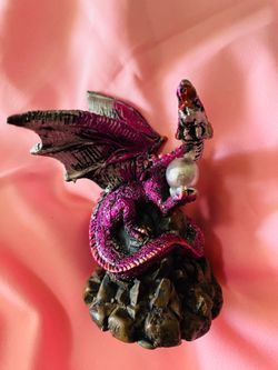 Detailed resin dragon figurine is purple and silver with a metallic finish. This piece is approximately 4 inches tall and features a dragon perched on