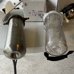 two water filters, good shape, one stainless steel and solid brass