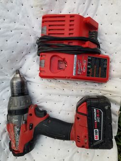 Milwaukee hammer drill with battery 5.oah and charger