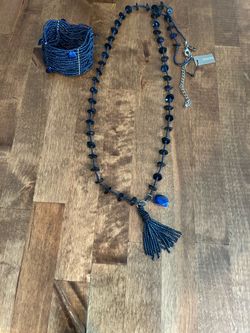 Never worn Chicos Navy blue necklace and matching bracelet