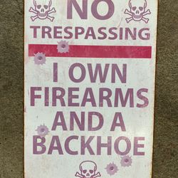 I Own Firearms And A Backhoe Sign 