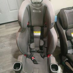 Two children Carseats Brand Garco And The Other Brand Is Safety 1st