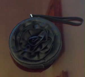 Photo Elegant small black round rose purse $20 only used once.