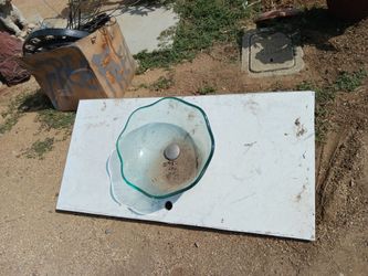 Free glass sink with marble countertop