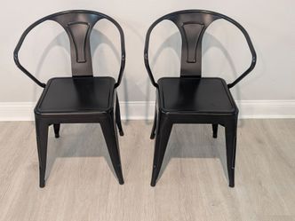 Black Tolix like metal armchairs