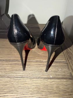 Red bottom black patent pumps