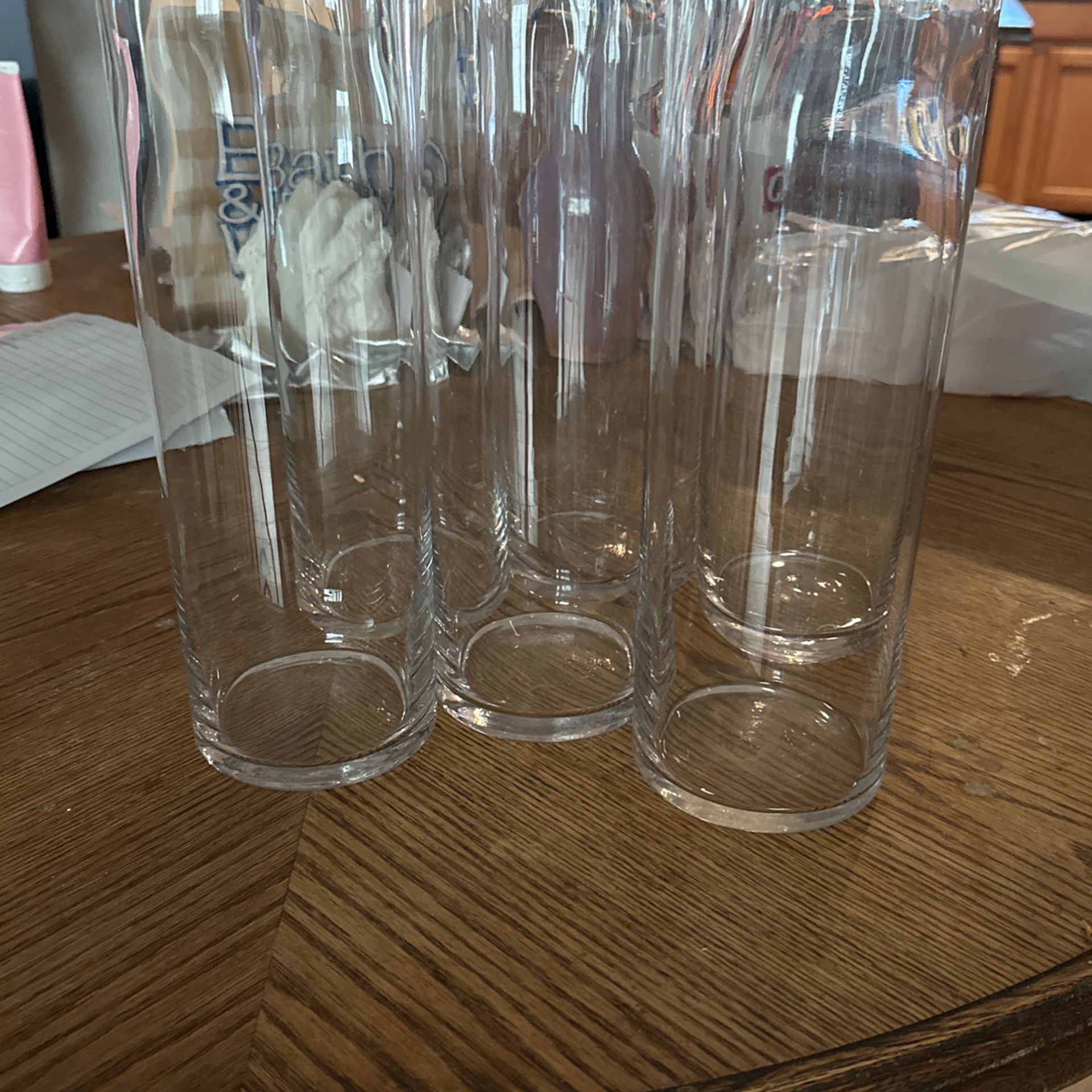 6 clear Glass Cylinder Vases And 2 Bigger vases 