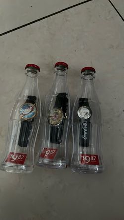 Vintage Coca-Cola watches still in a bottle never opened 50 for the set