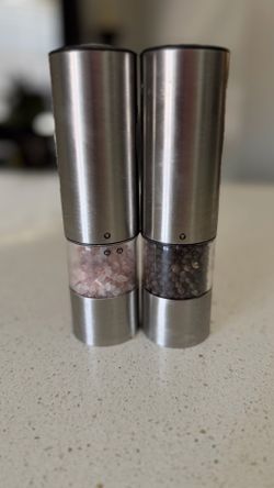 Battery operated salt and pepper dispensers