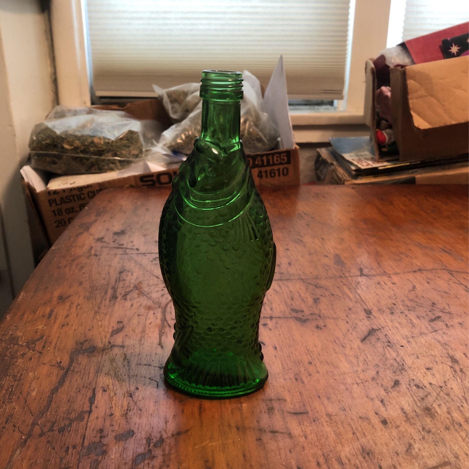 Vintage green fish bottle