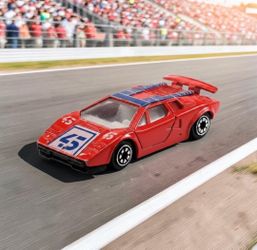 Yatming Lamborghini Countach Tomica Design Red #45 Racing Decals Die-Cast 1:64 Toy. The item shown is a vintage 1:64 scale Yatming #45 Lamborghini Cou