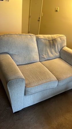 Beige sofa and loveseat