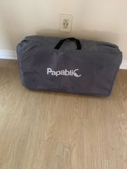Portable tri-fold mattress is made by Papablic. It has a white quilted top surface and a grey mesh side and bottom. The mattress folds into three sect