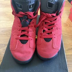 he product is a pair of Nike Air Jordan 6 Retro 'Toro Bravo' sneakers in the Varsity Red/Black colorway