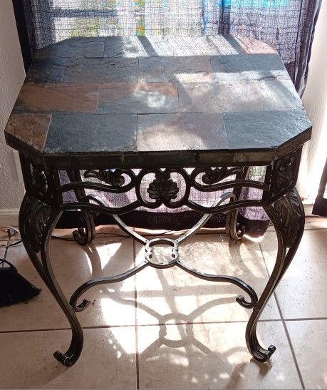 2 Heavy duty iron framed and stone tiled top end tables that measures about 26" x 26" x 27.5" H.