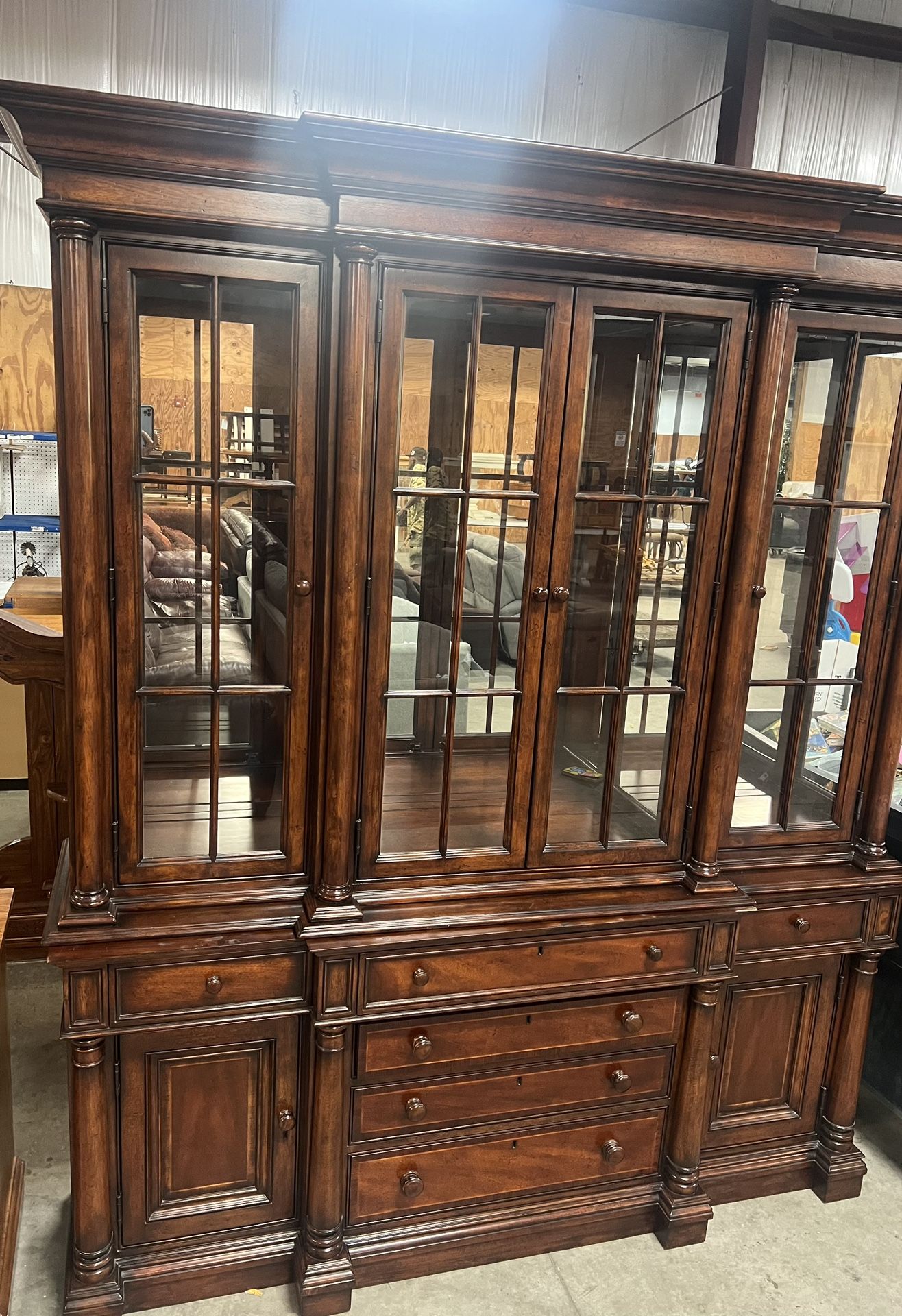 Thomasville china cabinet. Used in good condition with some cosmetic blemishes. There are some scratches and scuff marks in different areas there are