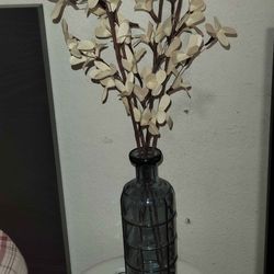 Grey Glass Bottle With White Artificial Eucalyptus Stems