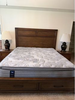 King mattress on pedestal bed frame.