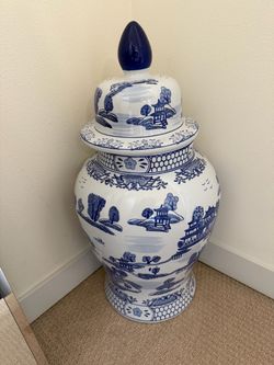 Blue and white ceramic pot with lid