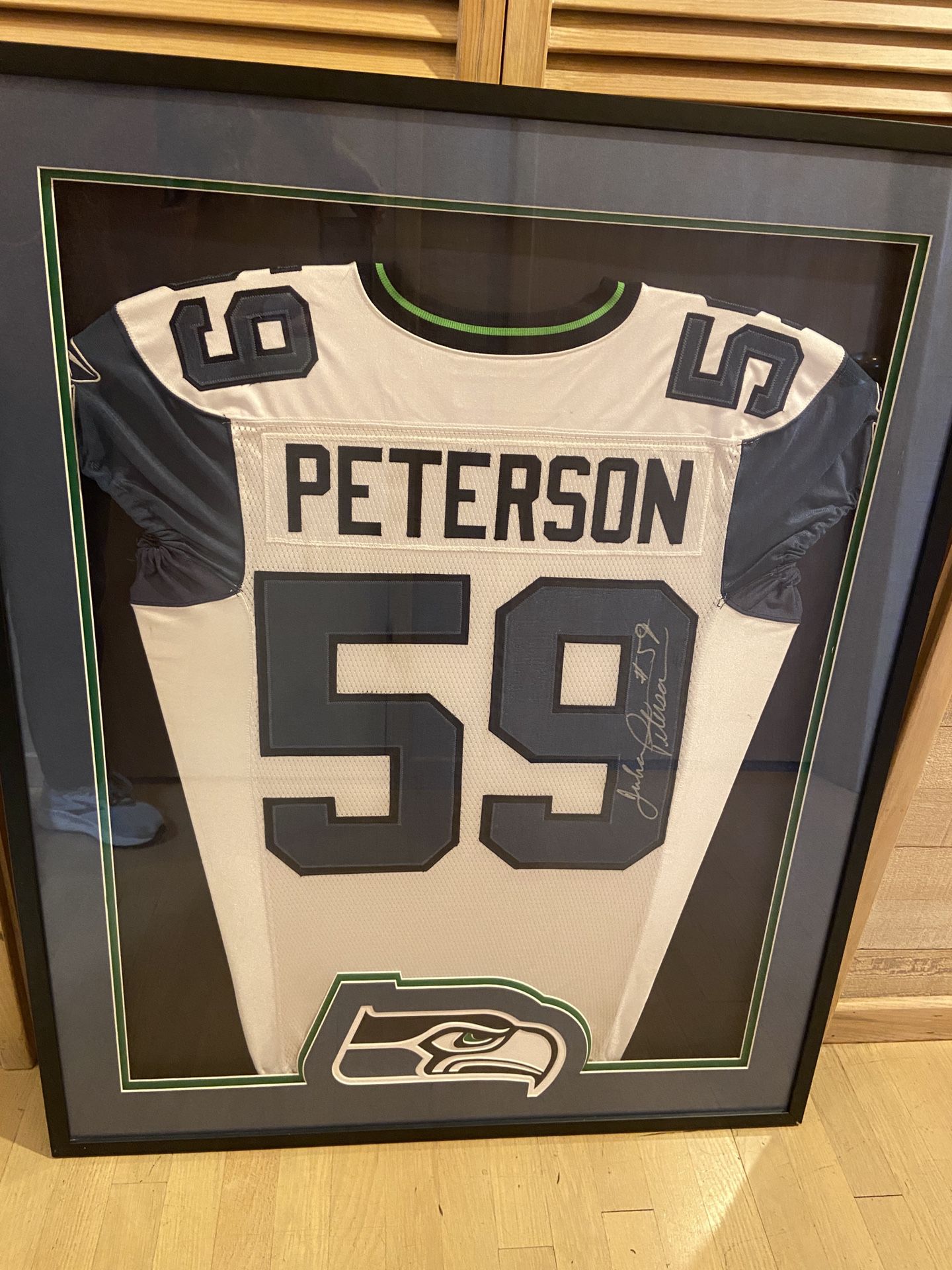 Seahawk Picture Frame With A Signed Julian Peterson jersey’s 