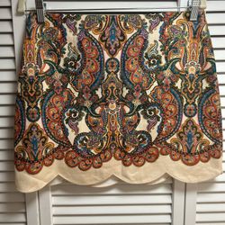 Imported Highlights beige/multicolour linen/flax Multi Paisley print two side inset pockets thigh-length cotton lining scallop hem rear zip fastening 