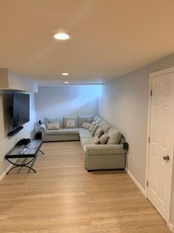 Seafoam green/ light blue sectional with two pull out bed options