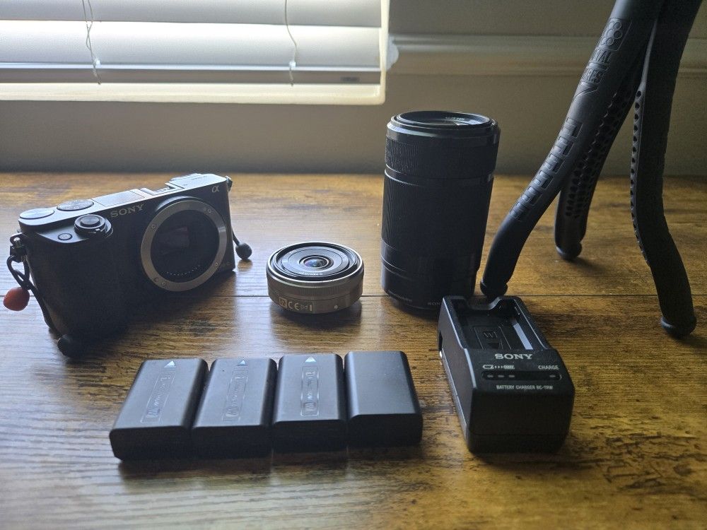 Sony Alpha A6000 Mirorless Camera Bundle - 50mm & 24mm Lensed, 4 Batteries, Charger, Tripod
