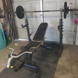 Olympic Weight Bench With Squat Rack Leg Developer curl bar & Olympic Weight set 140lbs read Descri

