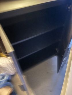 Black wood cabinet with shelves