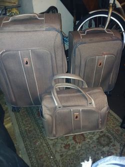 London Fog Newcastle Softside luggage set durable woven herringbone fabric and classic tin tam accent 8 low profile 360 degree multi directional spinn