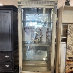 Elegant display cabinet with glass doors.